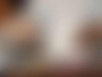 Well-to-do woman at cluttered desk, using a calculator to understand her credit score in Australia