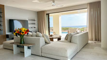 Oceanfront Entertainment Room – Custom Modern Sofa – Modern Side Table – Big Ass Haiku Fan – Pacific Ocean Views