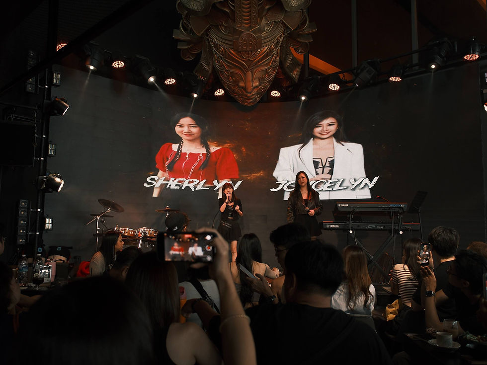 Vocal Collective students Sherlyn and Joycelyn performing live during the VC Showcase 2026 in Singapore after completing structured vocal training through the VC Method.
