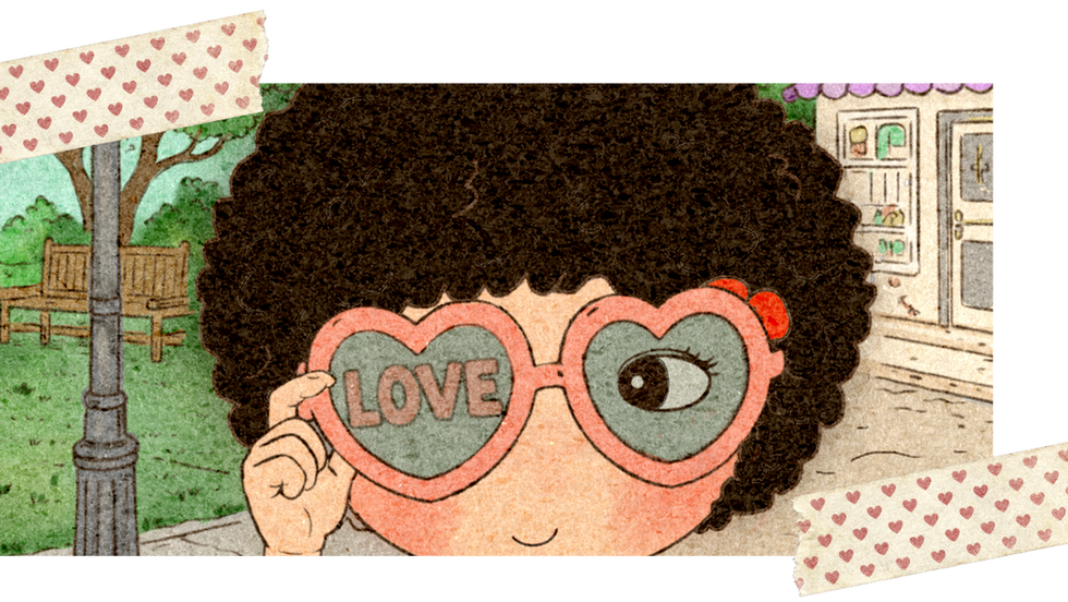 Scrapbook-style illustration of a little girl wearing heart-shaped love glasses in a whimsical pastel storybook street scene.