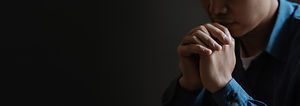 a-young-man-sits-and-prays-to-god-with-faith-and-2023-12-08-04-50-57-utc.jpg