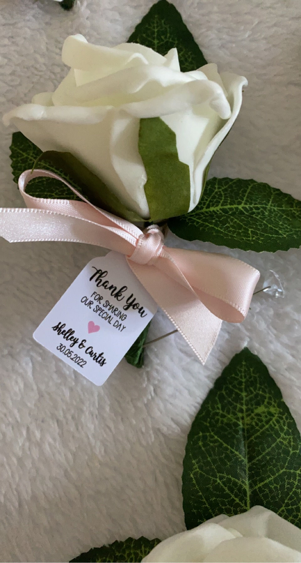 Ivory Foam Buttonholes With A Pink Bow