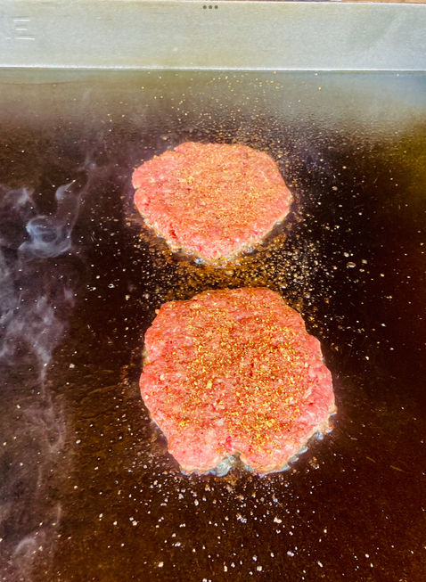 hamburger patties on grill