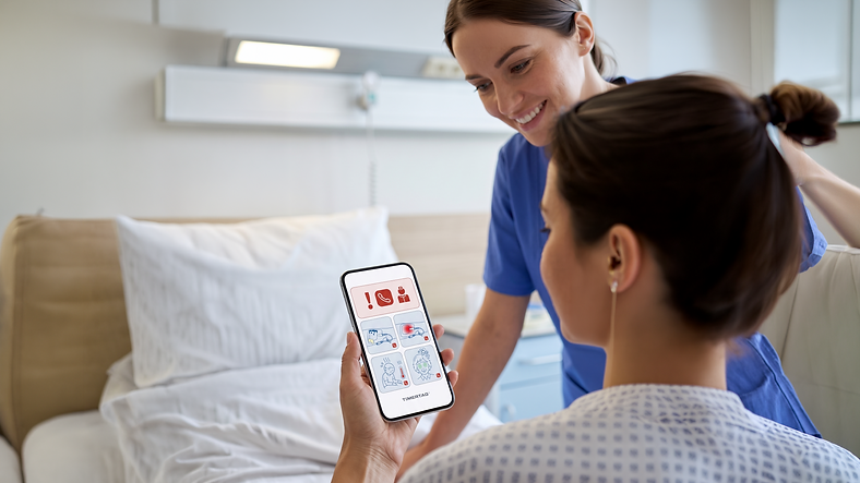 16 by 9 Patient Holding Phone with nurse 1 PNG.png