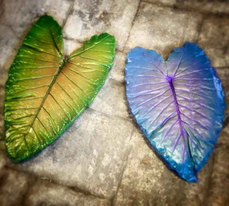 Thumbnail: Handmade concrete stepping stones with detailed hand-painted illustrations