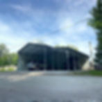 Wide 22x25x10 metal carport with a 10x25x7 lean-to addition, sheltering an SUV and UTV on a concrete pad.