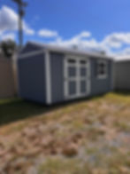 6ft double shed doors featuring transom windows and heavy-duty deluxe hinges on a wood workshop.