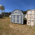 10x20 Lofted barn portable storage building with double wood doors, gray paint, white trim, metal roof and double wood doors.
