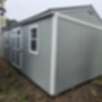 12x24 Side utility storage building with double doors, two windows, gray paint and white trim on the Moncks Corner lot.