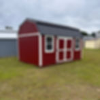 Red 10x16 side lofted barn shed with black metal roof, white trim, and 6ft double doors. Includes lofts and electrical.