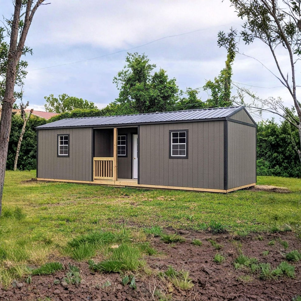Side view of 32-foot gray portable cabin showing three windows and long, modern profile.