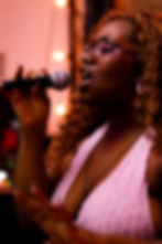 Woman singing into microphone