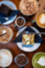 Overhead view of coffee drinks and desserts