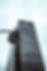 A survelliance security camera in front of a high-rise building