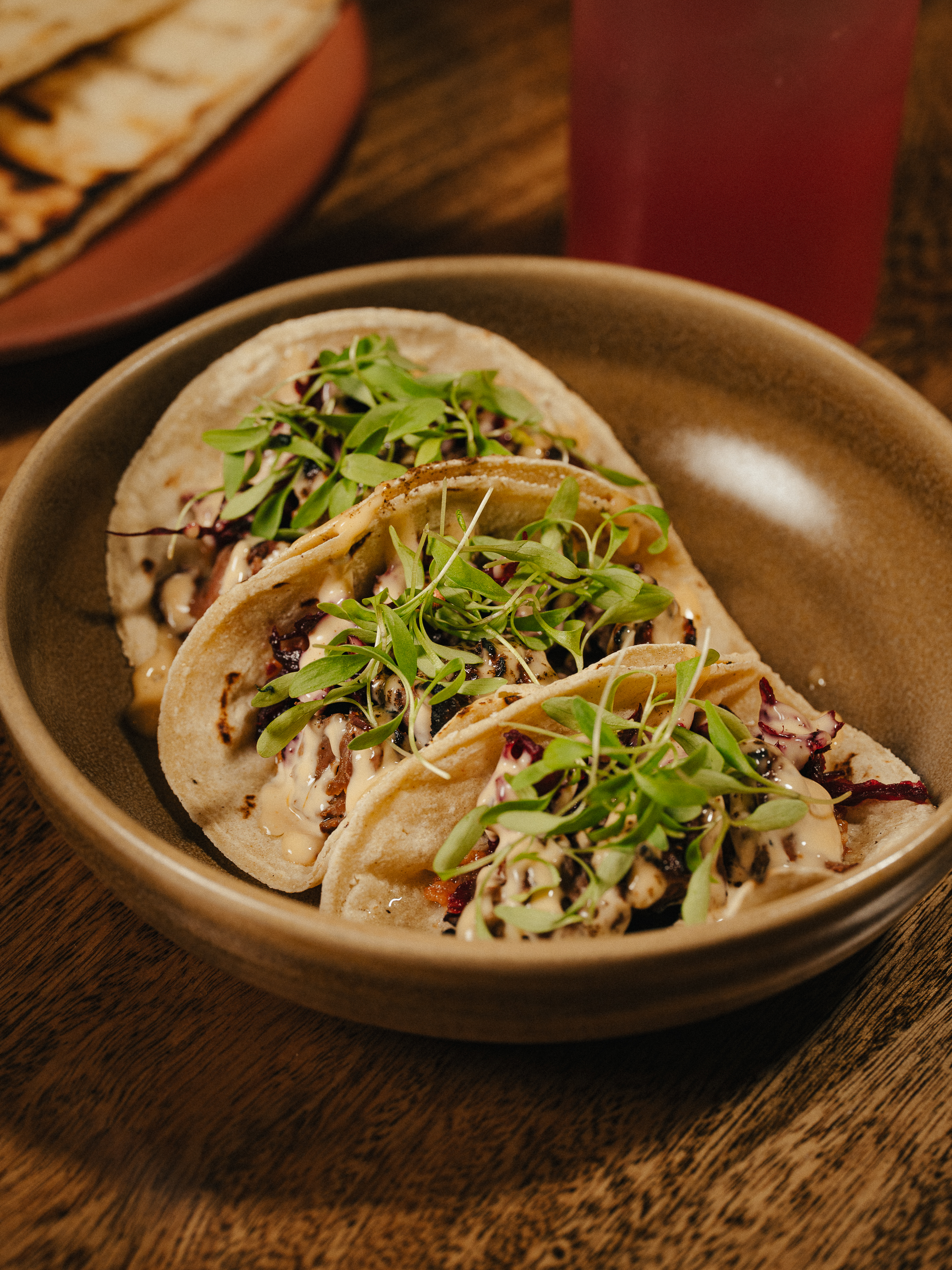 Tacos with fresh greens at La Estrella Barra Local