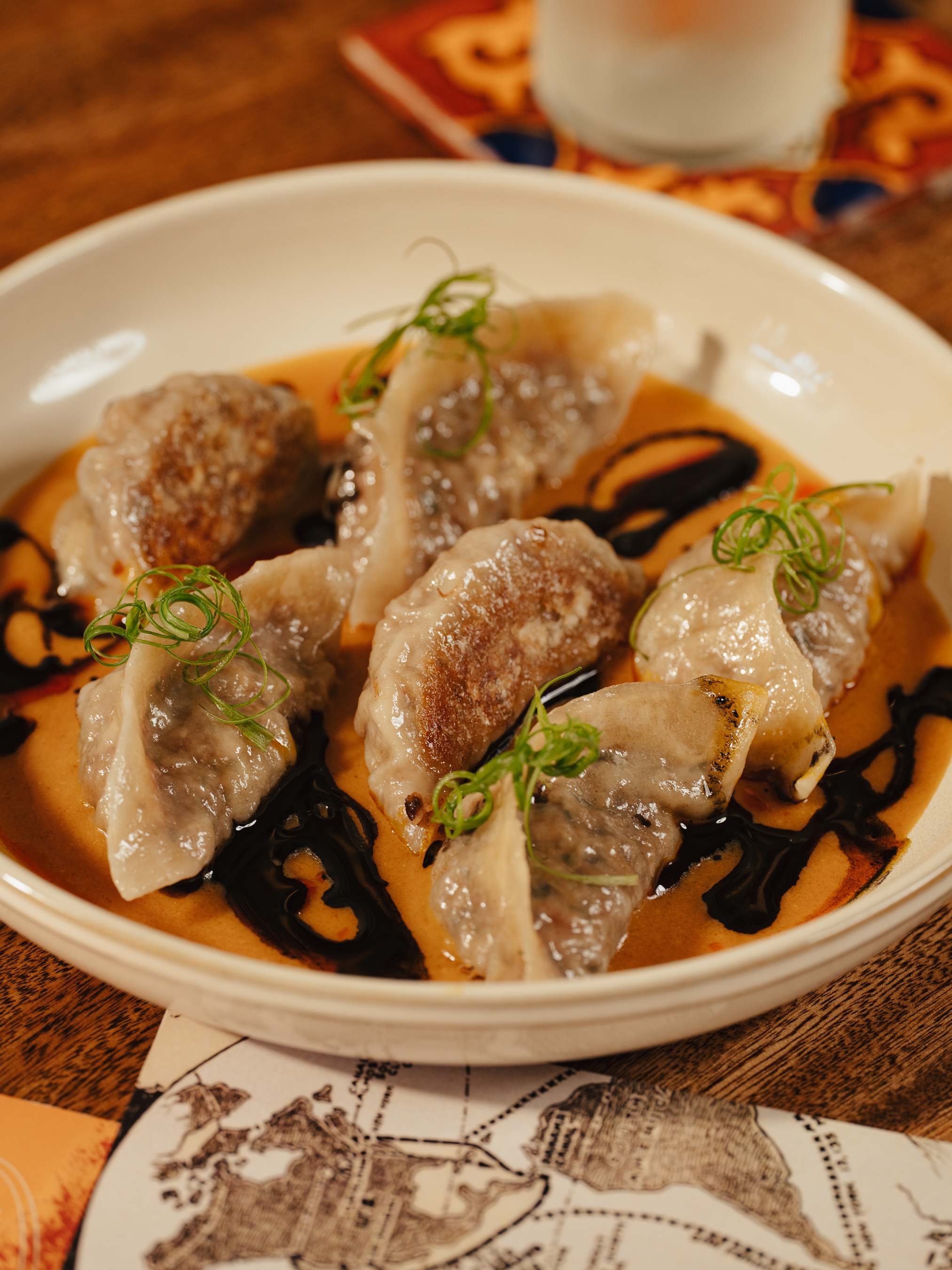 Dumplings with dipping sauce at La Estrella Barra Local