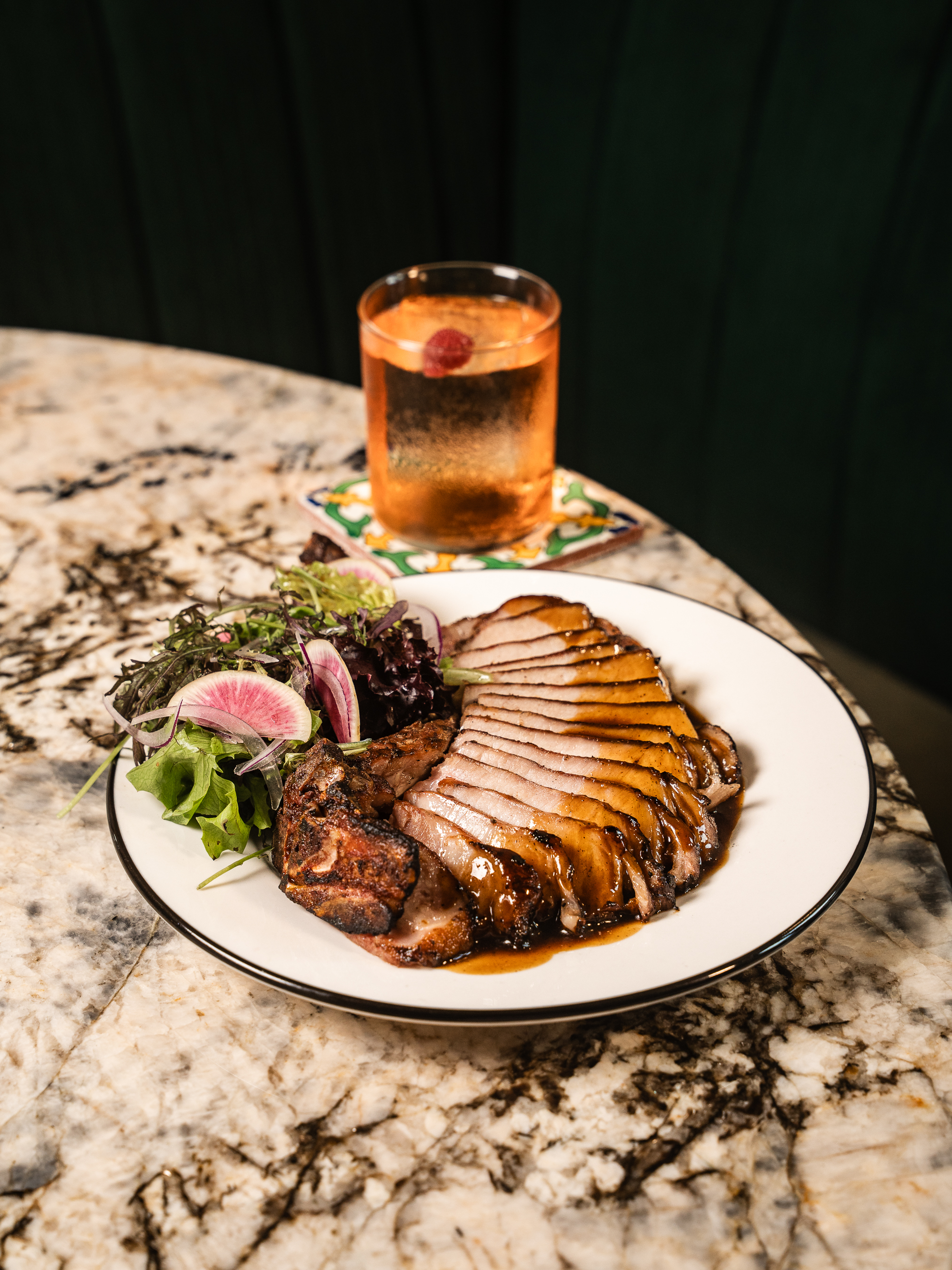 Sliced pork with rice at La Estrella Barra Local