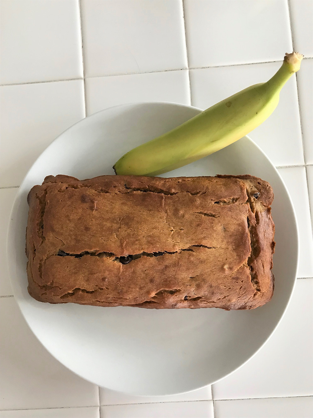 banana bread with banana on plate