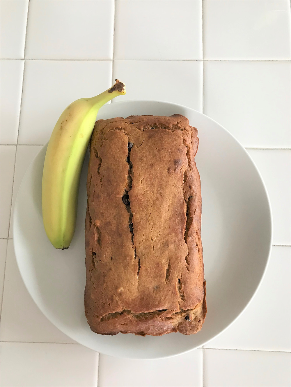 banana bread with banana on plate