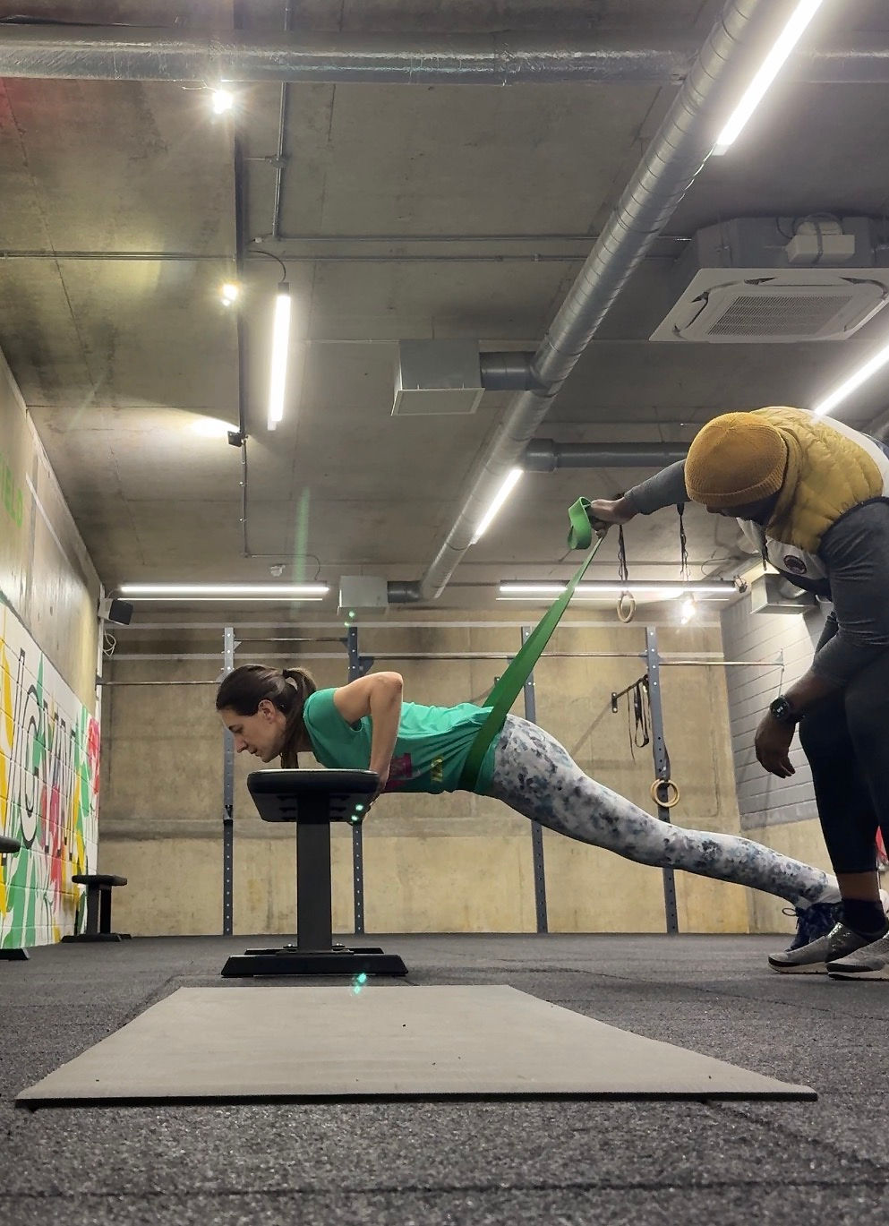 Gift McLaren Personal Training supporting clients to do inclined push ups