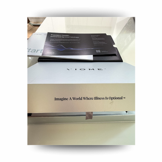 Two black VIOME boxes on a white table, labeled Full Body Intelligence, one above the other with a sleek minimalist look