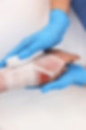doctor-bandaging-patients-burned-hand-600nw-2416394987_edited.jpg