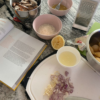 stock photo of a messy kitchen cutting garlic and onions
