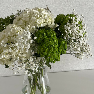 stock photo of white in green flowers in a vase