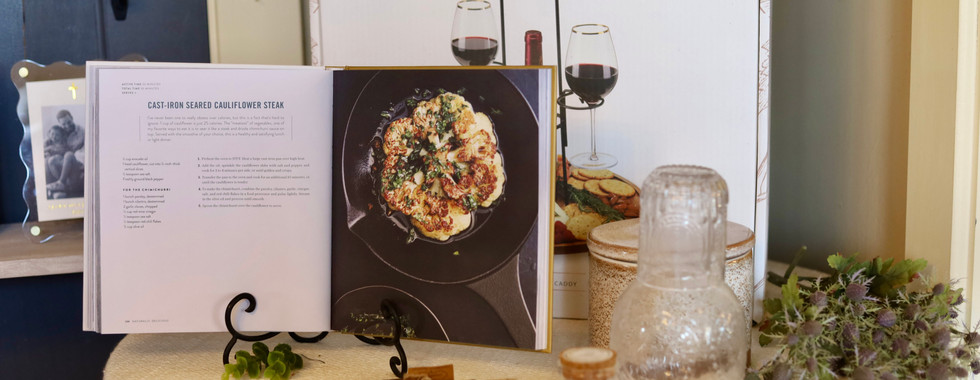 Curated winery boutique display featuring wine bottles, cookbooks, and entertaining essentials at WaterTower Estates Winery in Terre Haute