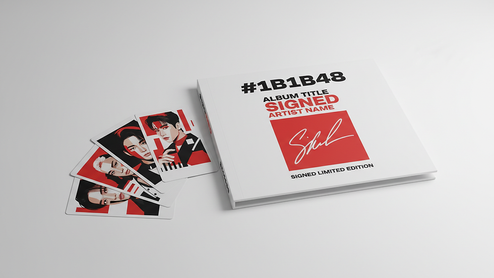 Close-up view of a signed K-pop album with photocards on a table