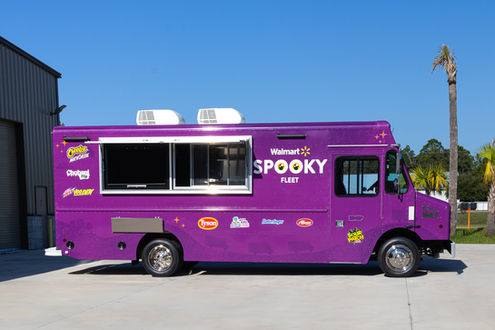 Custom food truck with an open awning, built by Premier Food Trucks in Charlotte, North Carolina.