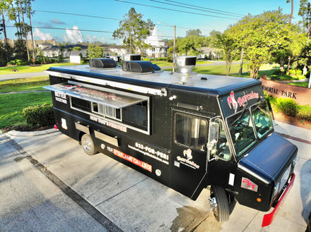 Drone view of Barcelos USA 20-foot food truck with open awnings, showcasing a spacious design for food truck building in Nashville, Tennessee.