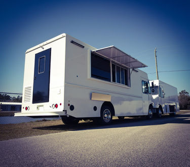 The serving window with open awnings on this RSM food truck shows the versatility of designs available from Premier Food Trucks for those interested in a food truck for sale.