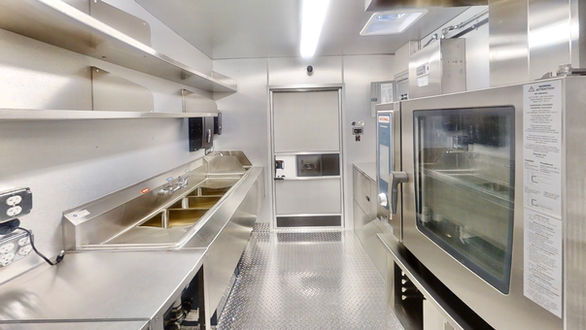 Interior view of Barcelos USA custom food truck with top-of-the-line equipment, expertly built for an efficient mobile kitchen.