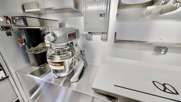 Interior view of the Hobart 20 Quart Mixer in Auntie Anne's food truck in Tampa, Florida, essential for pretzel preparation.