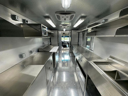 Interior perspective of the custom-built food truck by Premier Food Trucks. High-quality design for businesses interested in food truck building.