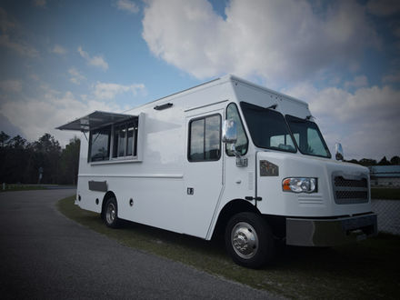 Custom food truck with an open serving window, built for Retail Sports Marketing by Premier Food Trucks, Charlotte, NC. Highlighting top-tier custom food trucks.