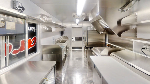 Perspective view of the interior of Barcelos USA food truck in Nashville, Tennessee, showcasing its well-planned layout, ideal for efficient food truck building