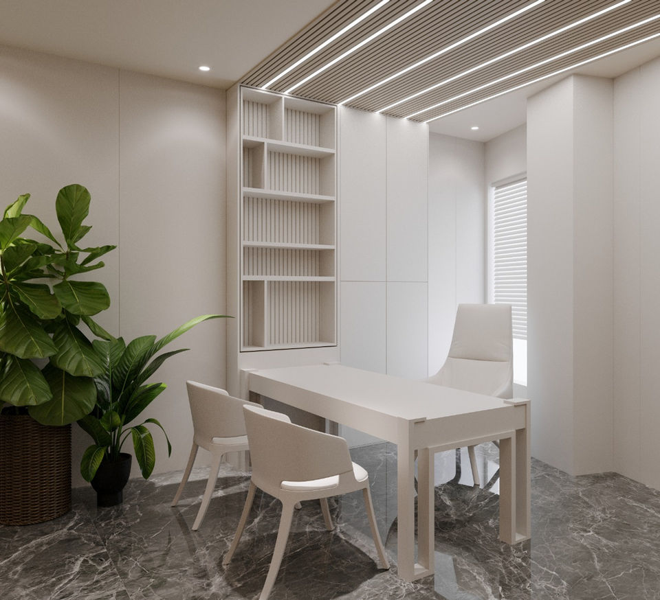 a room with a table and chairs and a plant