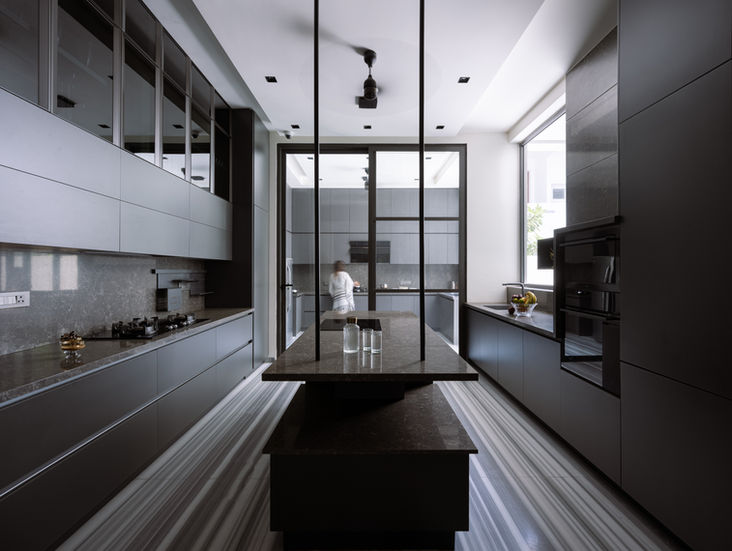 a kitchen with a large island in the middle