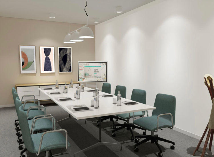 a conference room with a long white table and chairs