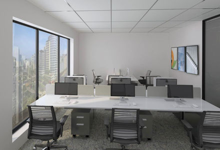 a row of office cubicles with computers and chairs