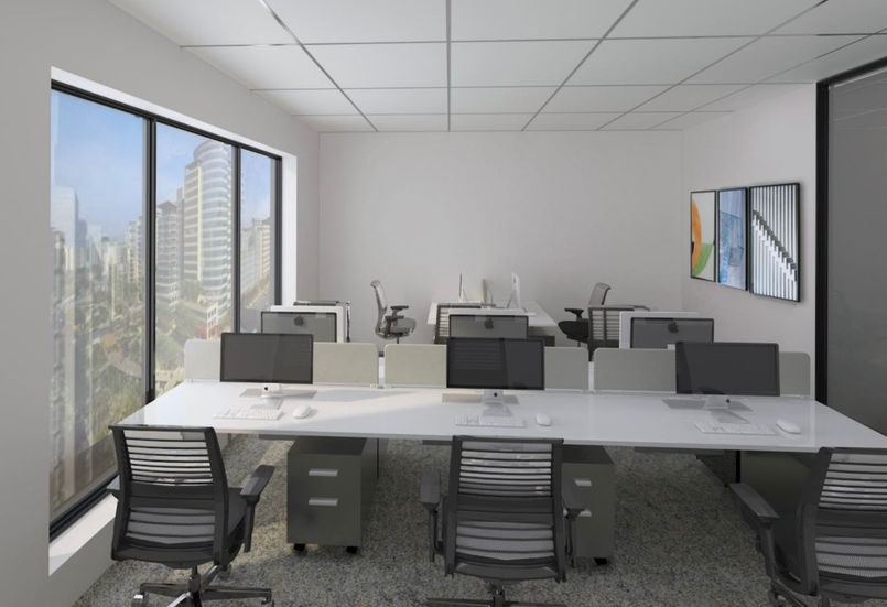 a row of office cubicles with computers and chairs