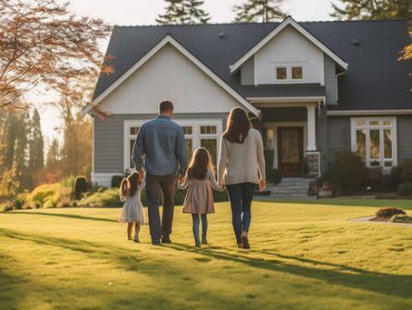 A family walking together towards their house in the fall