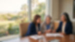 A cinematic photograph of a warm legal consultation in a modern conference room, where three smiling women are gathered around a wooden table. On the right, a confident attorney with greying hair points with a pen to an "ESTATE PLANNING & TRUST AGREEMENT" document, guiding an older client with grey hair and her adult daughter, who are seated to the left, both looking on with interest. Behind them, a large, floor-to-ceiling window offers a soft, sunny view of a tropical landscape with palm trees and a low cityscape. Natural, golden sunlight fills the room.