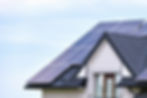 Residential house with rooftop covered with solar photovoltaic panels