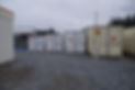 A view of shipping containers of different sizes
