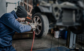 Mechanic Fixing Tire_edited_edited.jpg