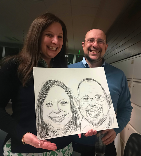 Couple holding their finished personalized caricature portrait