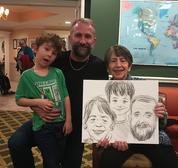 Families enjoying live caricature entertainment at a children's birthday party in Burlington.